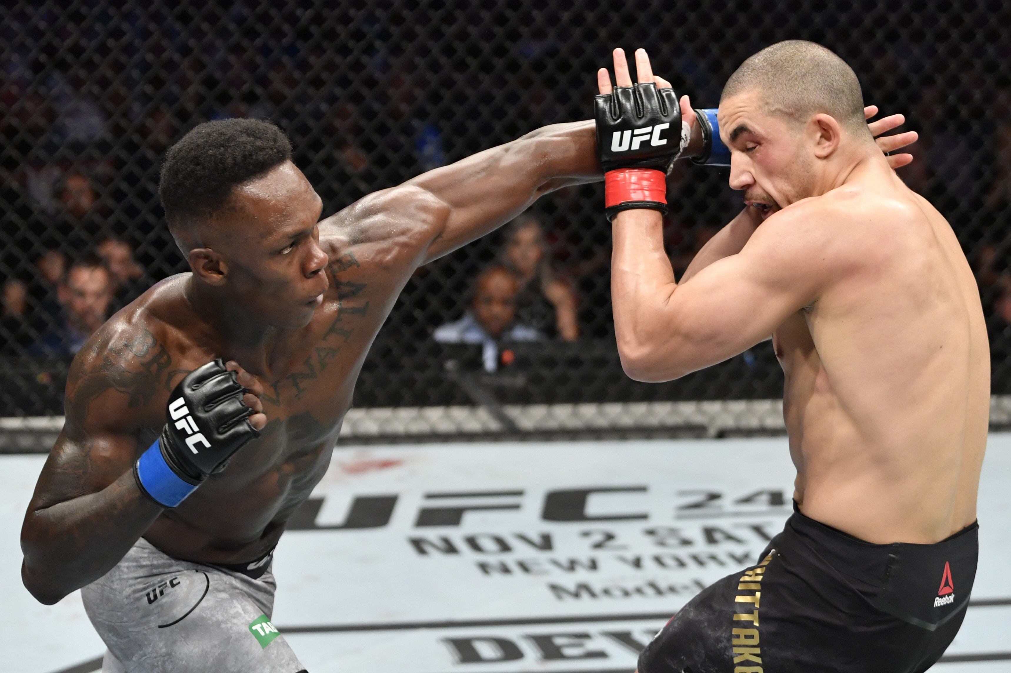 Israel Adesanya Earns Dominant TKO Win over Robert Whittaker
